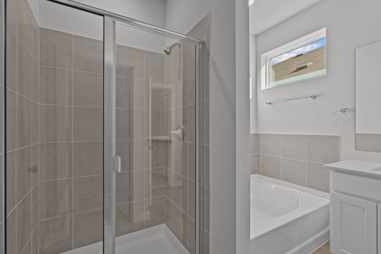 A bathroom with a glass shower.