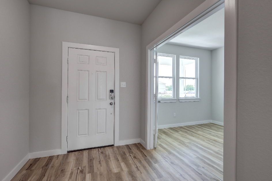 A room with a white door and a white door.