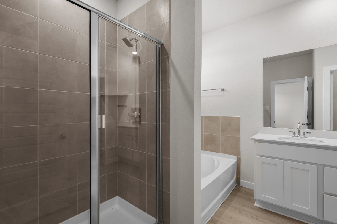 A bathroom with a glass shower.