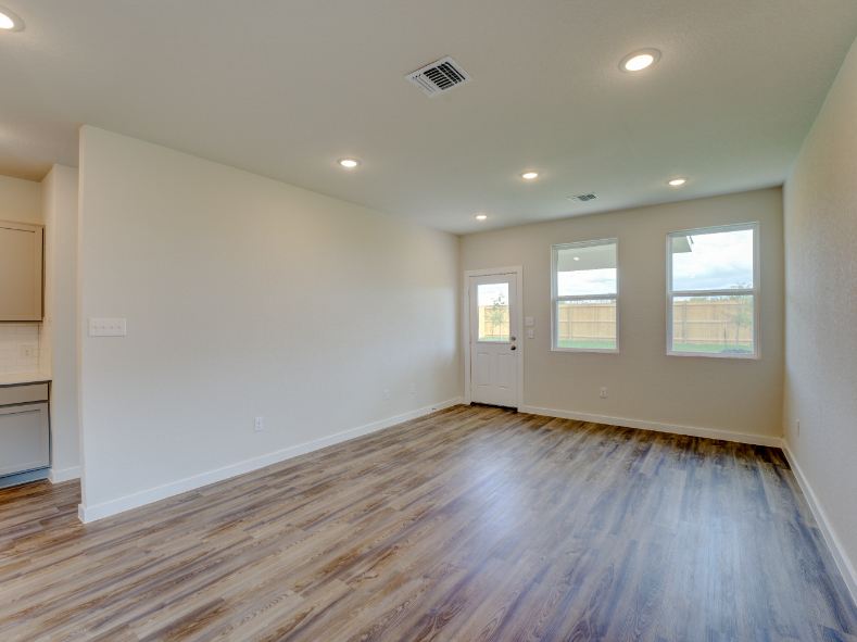 A room with a wood floor and a wood floor.