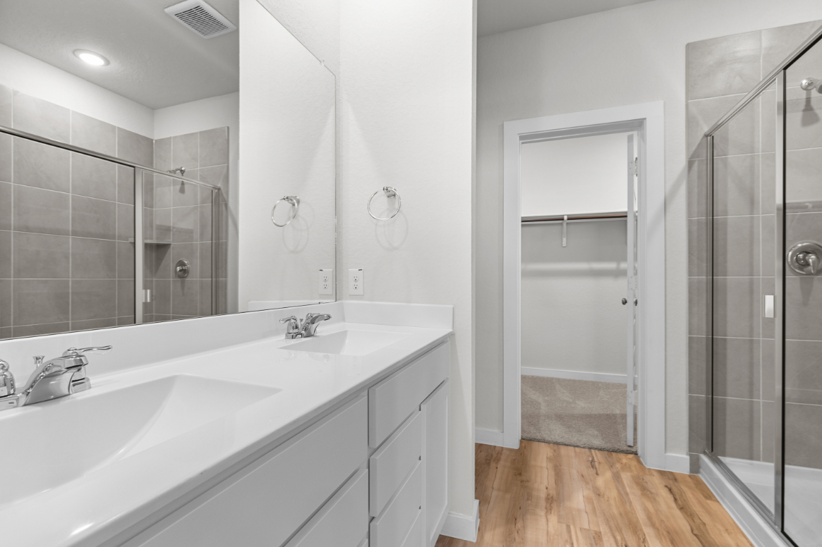 A bathroom with a glass shower.