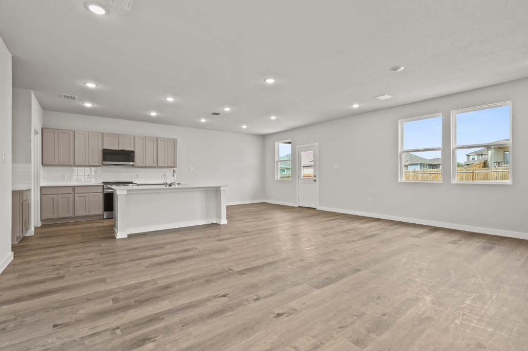 A large kitchen with white cabinets.