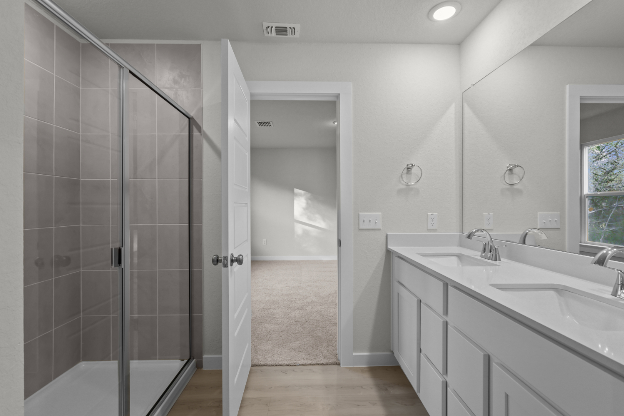 A bathroom with a glass shower.