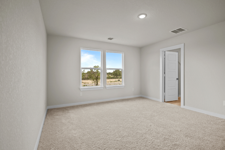 A room with a window and a door.