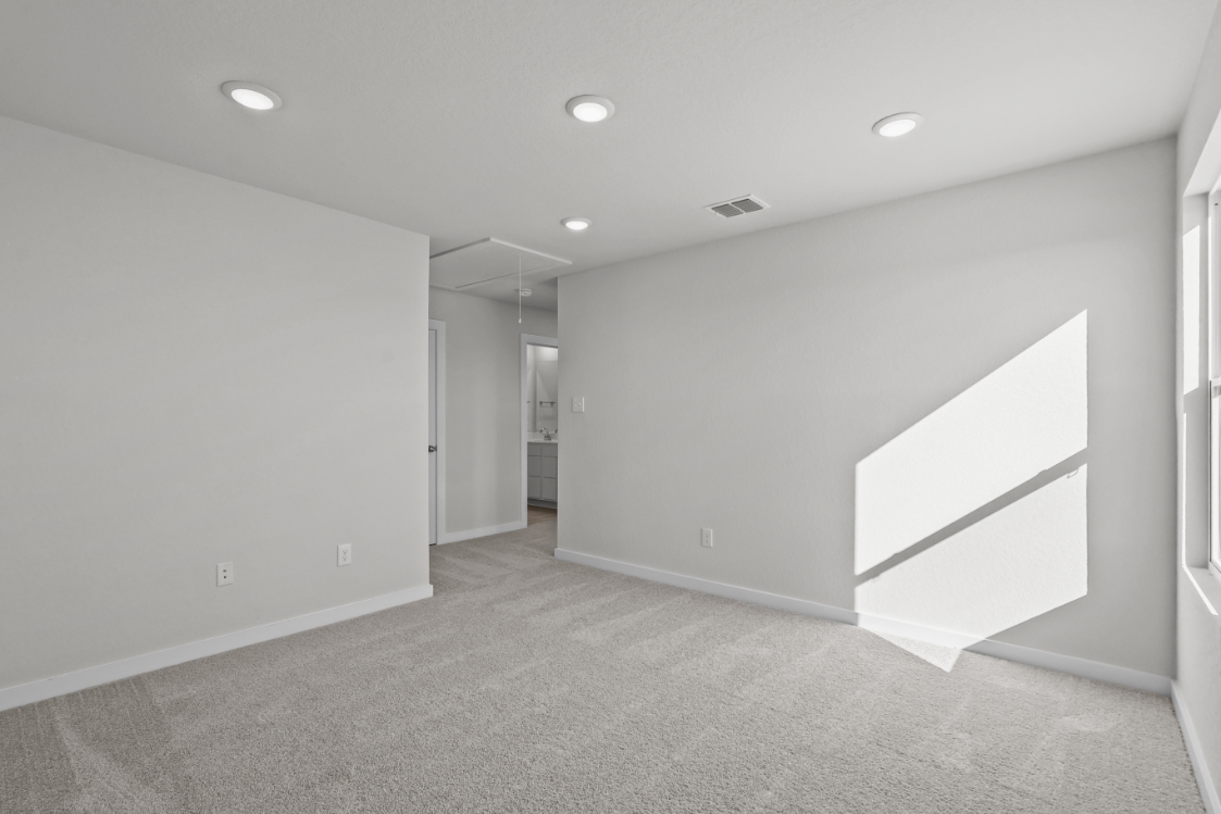 A hallway with white walls.