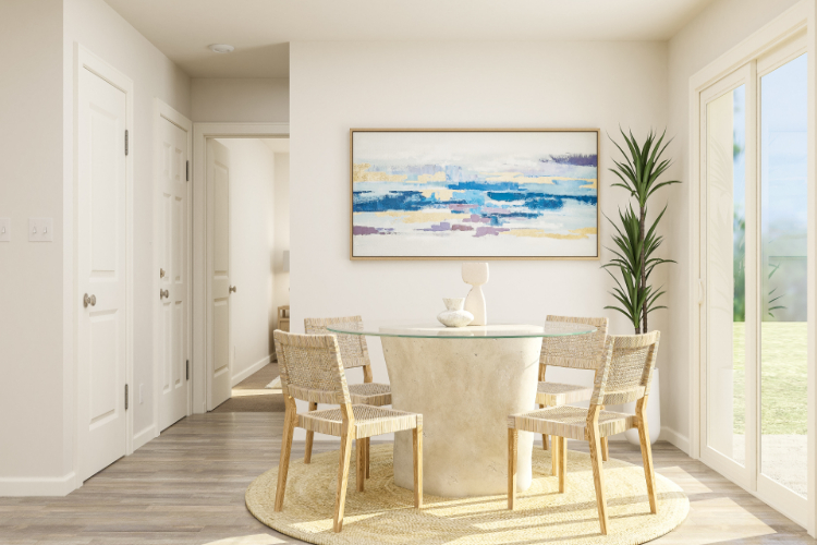 A dining room with a table and chairs.
