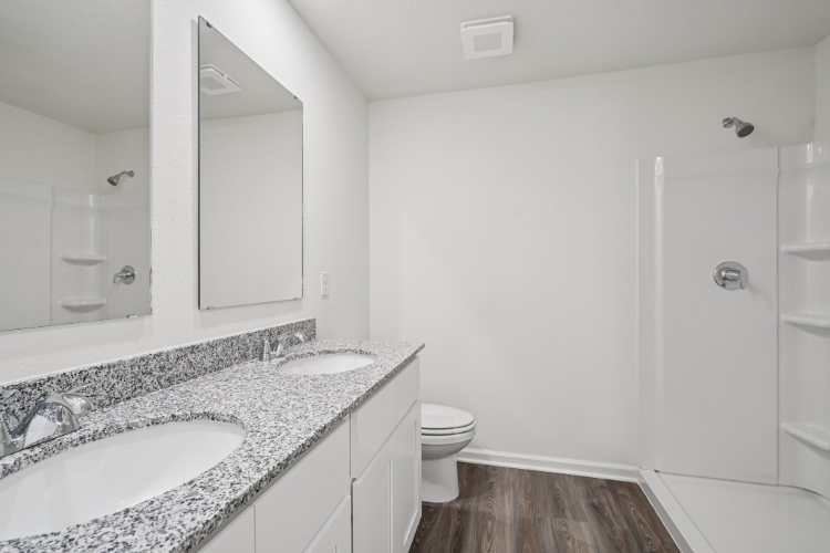 A bathroom with a sink and a toilet.
