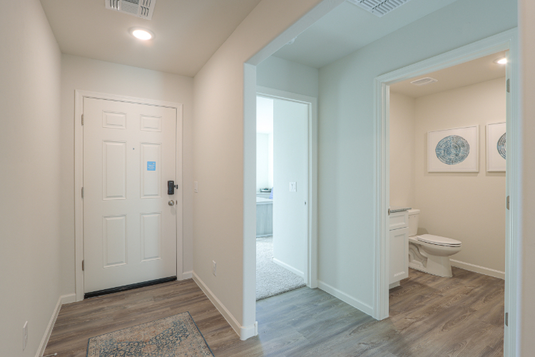 A bathroom with white doors.