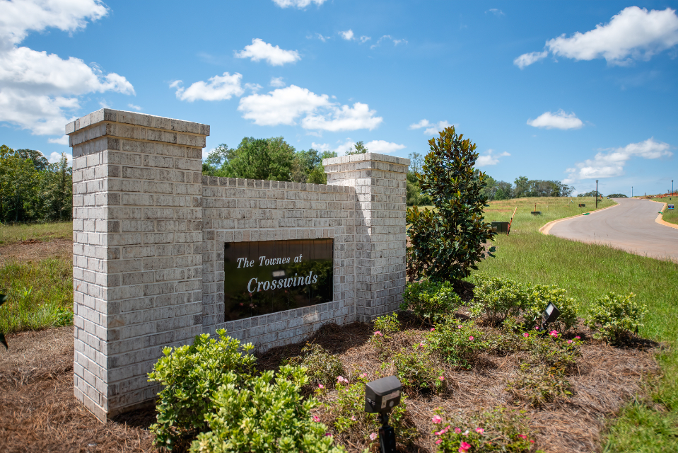 A stone wall with a sign on it.