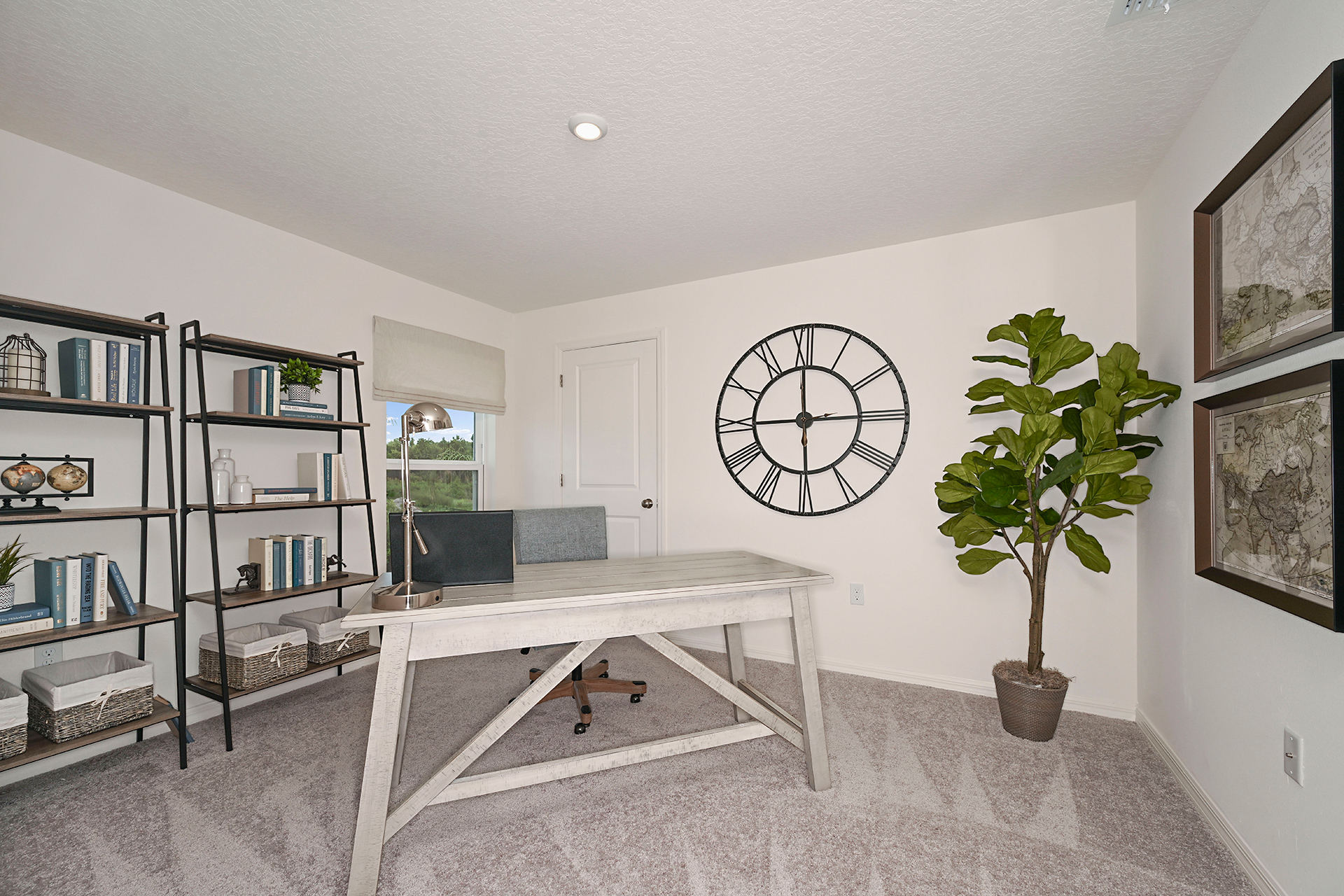 A room with a table and a clock on the wall.